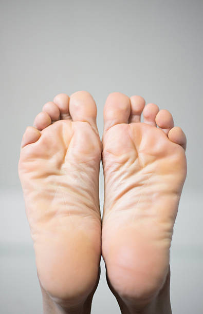 Image of people feet on a white background