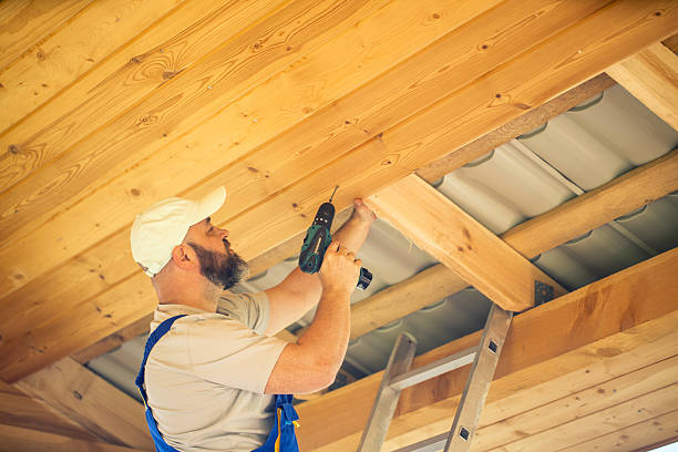 istock Carpenter Working on Wooden Roof Structure Using Electric Drill 2216187041