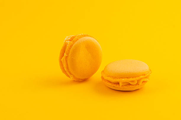istock Yellow macarons on a yellow background create vibrancy 2216188333
