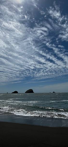 istock Dramatic clouds hovering over Wilson Creek Beach, California 2216189578