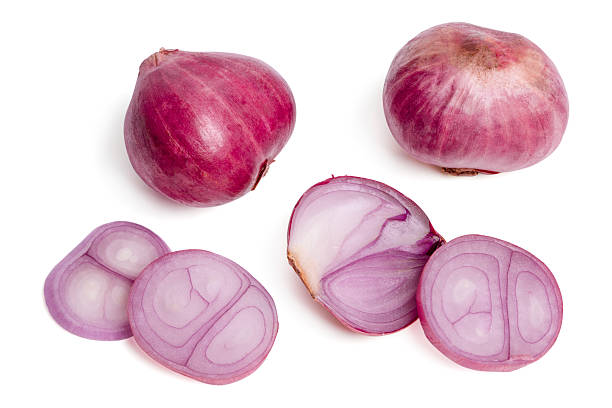 istock Top view fresh purple onion or shallot with cut slices on white background. 2216189612