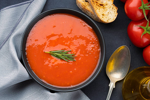 istock Homemade tomato soup on vintage black  table 2216195955