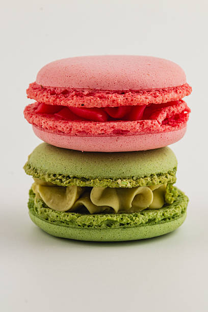istock Colorful macaron desserts stacked on a white surface 2216198991
