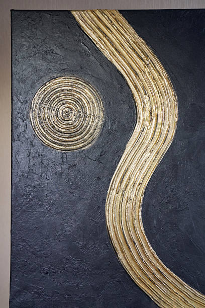 istock Abstract black and gold textured surface with circular and curved line patterns 2216202199