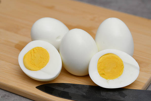 istock Breakfast set, hard-boiled egg cut in half on a chopping board, healthy diet 2216202931