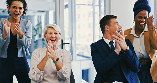 istock Clapping hands, celebration and business people in office with teamwork, success or collaboration. Happy, achievement and financial advisors cheering for company investment approval in workplace. 2216205947