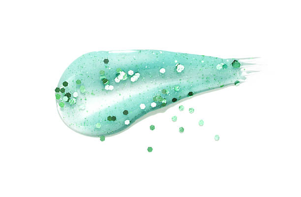 istock Green glitter gel smear with sparkling particles on white background 2216206489