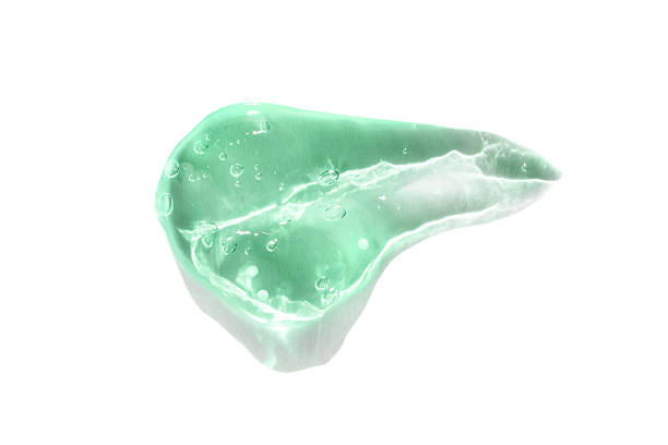 istock Green crystal soap with bubbles on white background 2216206503