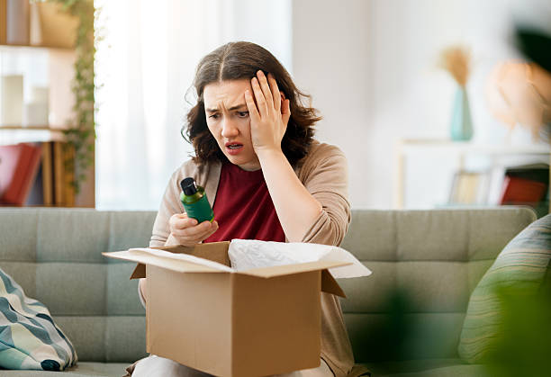 istock Woman is unpacking cardboard 2216206680