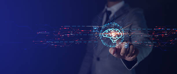 istock A man in a suit is pointing to a brain on a computer screen. Concept of technology and the human brain, and the mood is one of innovation and progress 2216208325