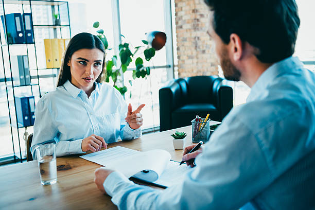 istock Professional business interview conversation between coworkers discussing ideas in a modern office setting 2216210697