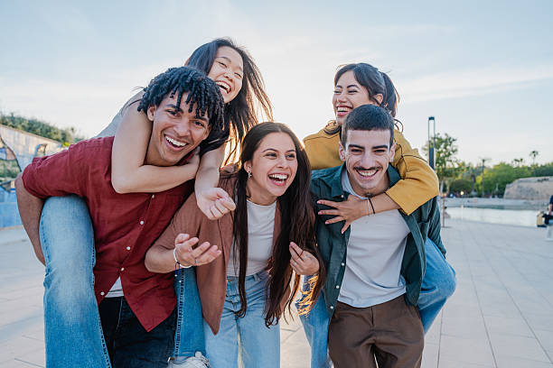 istock Multicultural friends laughing and playing on sunny day 2216211549