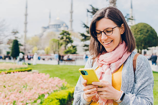 istock Cheerful woman using a mobile phone in Istanbul 2216212325