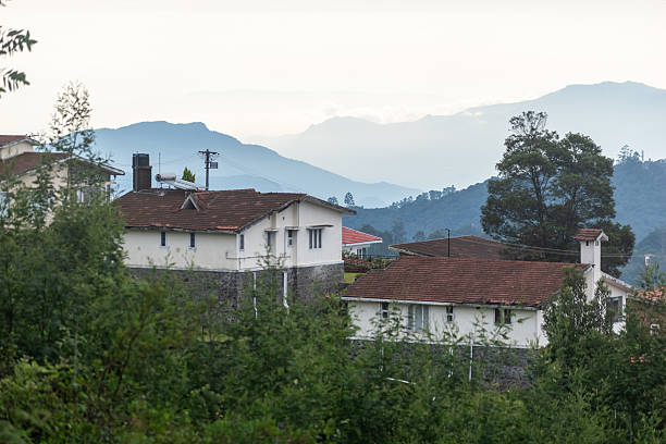istock Houses with tiled roofs overlook misty mountains 2216217112