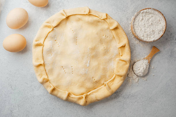 istock Pie dough preparation with flour and eggs in minimal  baking setup 2216217527