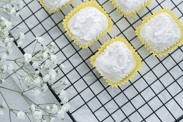 istock Delicate square desserts arranged on a cooling rack with floral accents 2216217620