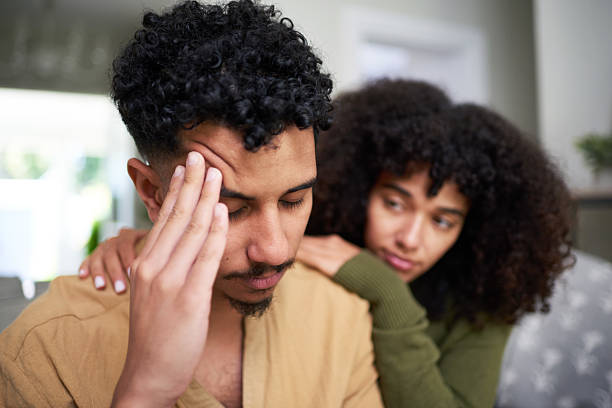 istock Male Stress - Couple at Home Sharing Emotional Support in a Compassionate Setting 2216219032