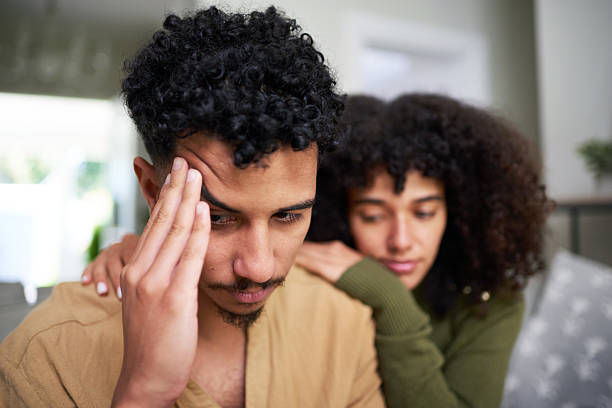 istock Male Depression - Couple Experiencing Emotional Support and Bonding at Home 2216219171