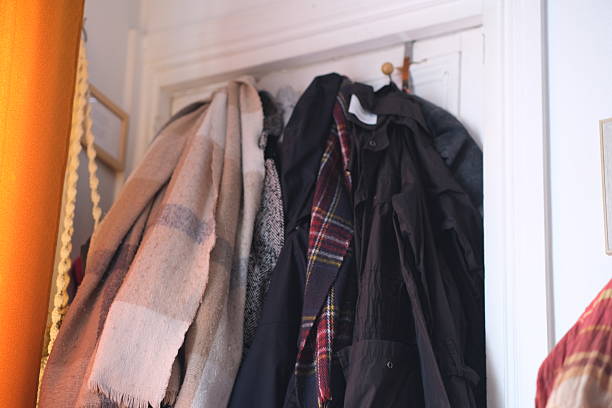 Clothes hanging effortlessly on a hook in a warm atmosphere. This photo reflects the everyday life