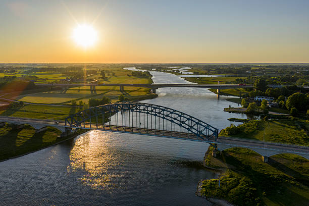 istock Bridge in a springtime colorful sunset over the river IJssel 2216223745