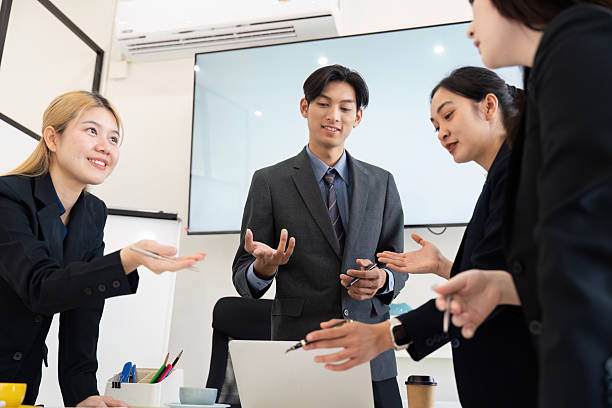 istock Team Discussion and Business Strategy. Colleagues engaging in conversation to discuss project updates and strategic planning. 2216226316