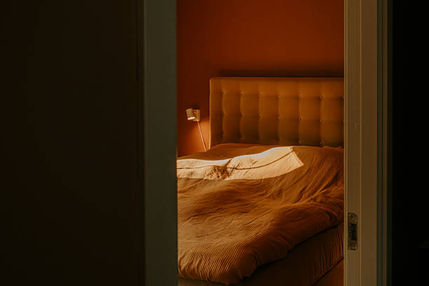 warm terracotta orange bedroom with bedding