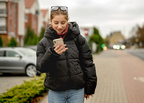 istock Happy Girl Waiting Outside For Someone 2216232341