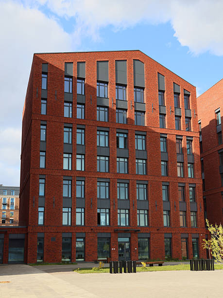istock A contemporary building made of red bricks, featuring large windows and modern design elements 2216233434