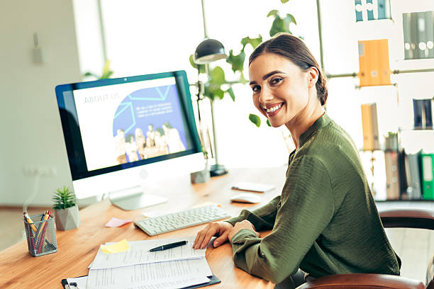 istock Confident young woman working in an elegant office environment, showcasing professional success and modern corporate style 2216233711