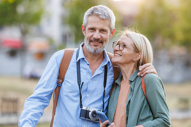 istock Happy mature couple exploring a city 2216236580