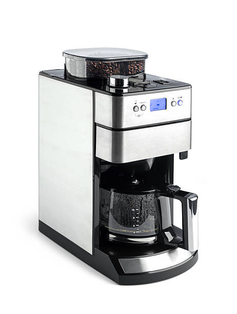 istock Modern drip coffee maker with built-in grinder, isolated on white background. Glass carafe, digital display, and stainless steel design. File contains a path to isolation. 2216236949