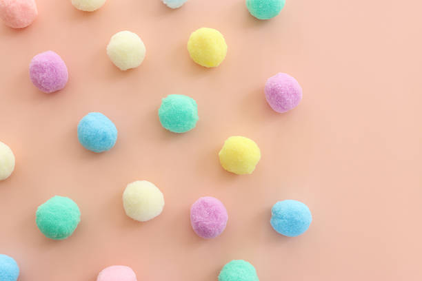 istock Colorful pastel cotton balls on pink background 2216238807