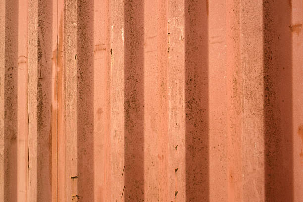 Rusty corrugated metal wall outdoors