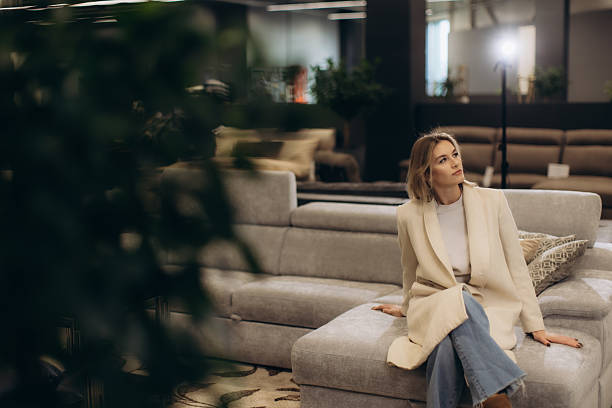 istock Stylish Woman Relaxing on Comfortable Sofa in Sophisticated Home Interior Setting 2216239719