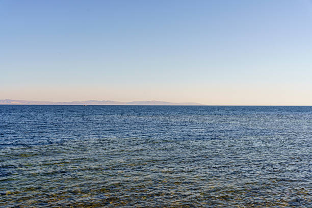 istock The ocean is calm and clear, with no visible waves or ripples 2216240081