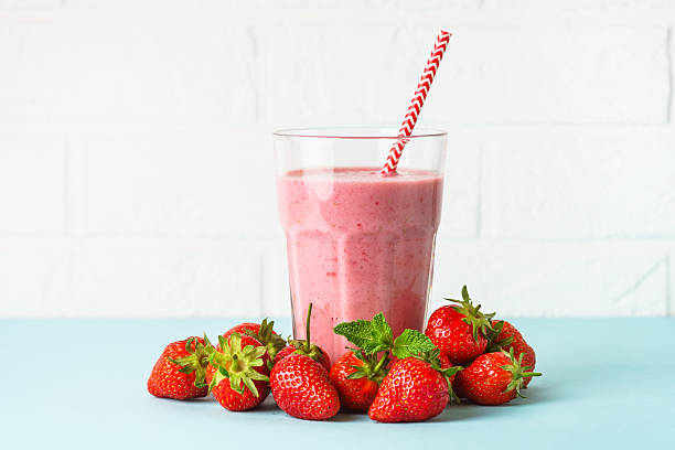 istock Strawberry smoothie or milkshake on white. 2216243754