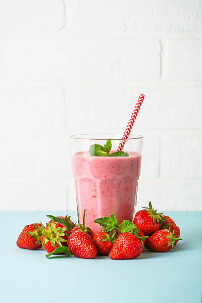 istock Strawberry smoothie or milkshake on white. 2216243756