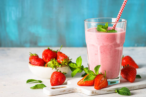 istock Strawberry smoothie or milkshake on white. 2216243793