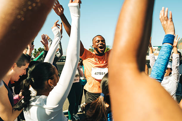 istock Marathon runners celebrating victory at the finish line 2216251391