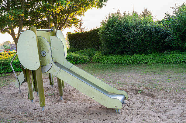 little girl having fun on beach playground in summer.