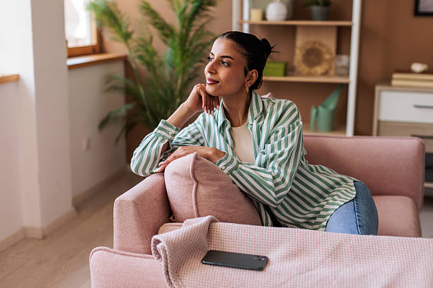 istock Young woman relaxing at home 2216252437
