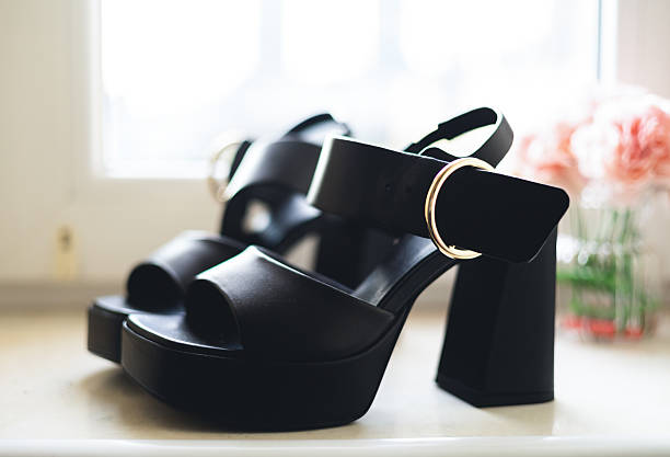 istock Stylish women's black sandals close-up 2216256886