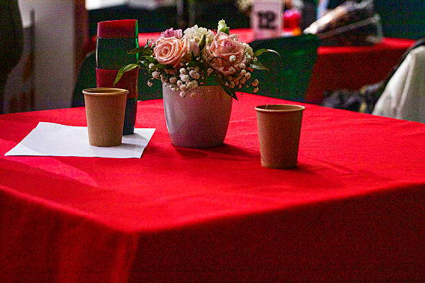 Beautiful wedding flower arrangement  with candles at florist workshop