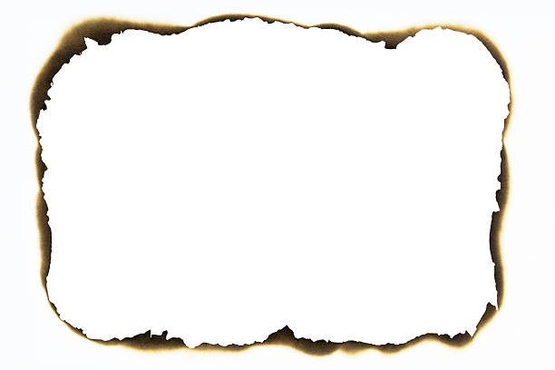 istock Burned hole on a white paper with clipping path. 2216257778