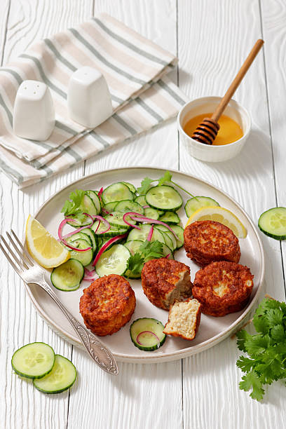 istock dutch fish cakes with cucumber salad on a plate 2216261422