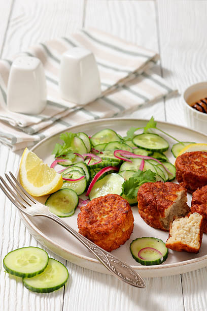 istock dutch fish cakes with cucumber salad on a plate 2216261429