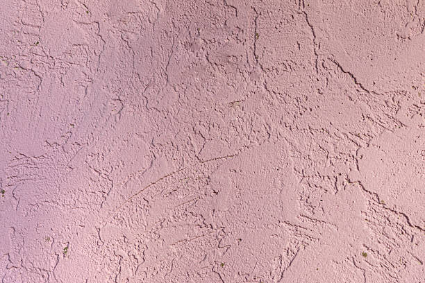 istock Textured light pink stucco wall with natural rough patterns, ideal for use in backgrounds, design, or architectural visuals. 2216263197