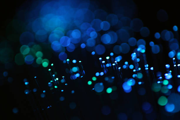 Fiber Optic Light Abstract Communication Connection Network Cable Background Navy Blue Green Teal Circle Bokeh Black Pattern Technology Texture Futuristic Copy Space  Macro Photography for presentation, flyer, card, poster, brochure, banner
