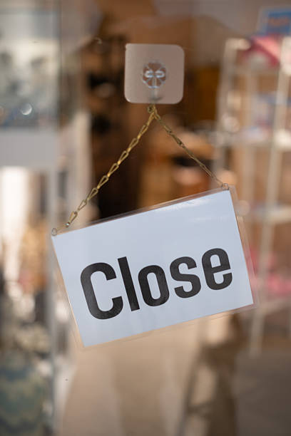 istock Close sign hanging on the mirror door 2216269214