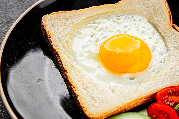 istock Fried gashouse eggs in bread egg in the basket delicious snack breakfast in a bowl fresh delicious gourmet food background on the table rustic food top view copy space 2216270000